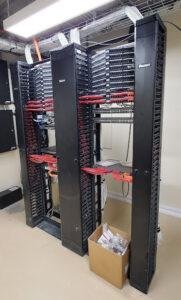 Modern server room with organized network servers and cables